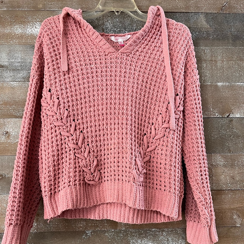 Pink sweater with hood.